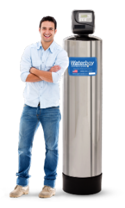 A smiling man stands next to a Waterboy 5000 SXT