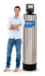 A smiling man stands next to a Waterboy 5000 SXT