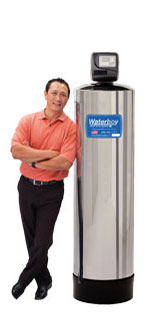 A man leans against a Waterboy 7000 SXT